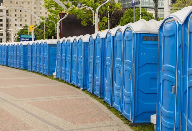 a row of portable restrooms set up for a large athletic event, allowing participants and spectators to easily take care of their needs in Balch Springs